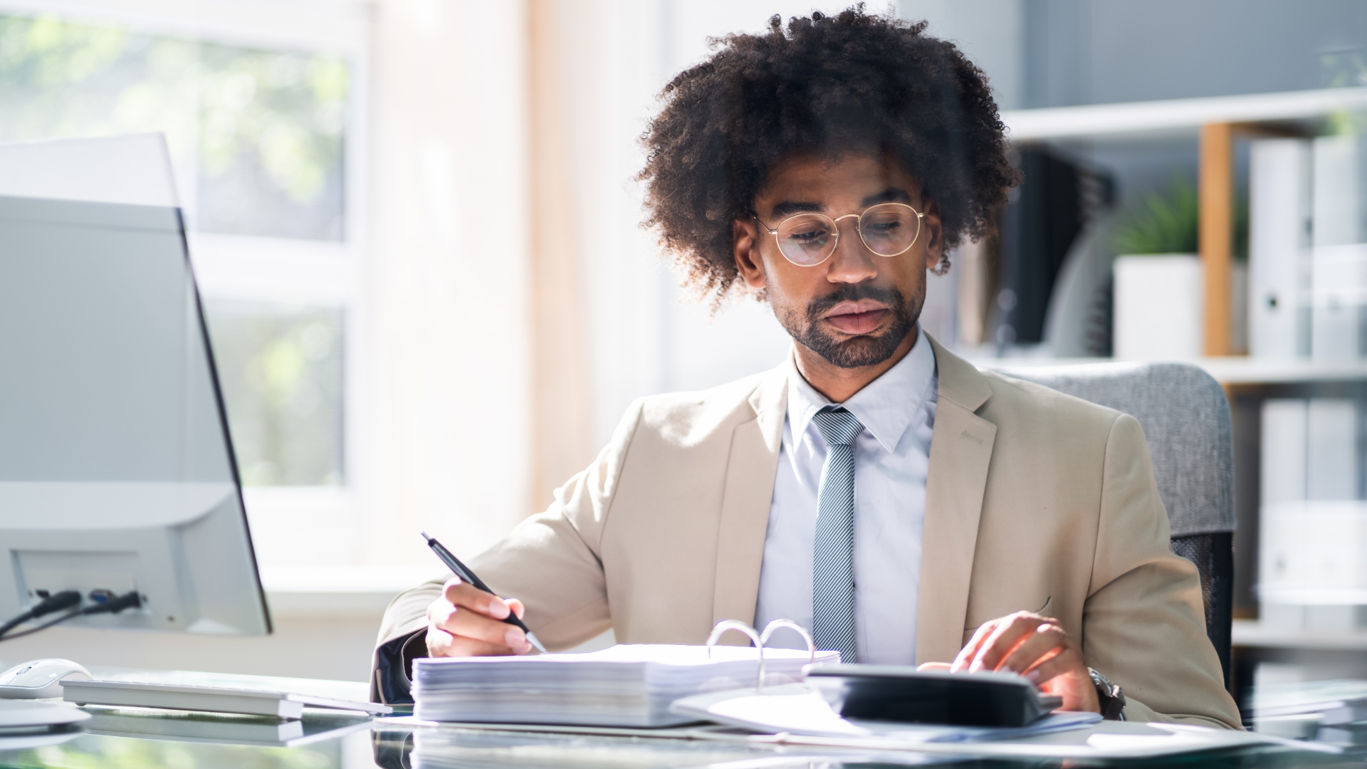 Business owner reviewing payment reports and invoices